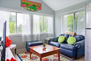 a living room with a blue couch and a table at Lewes --- 34266 Postal Ln in Lewes