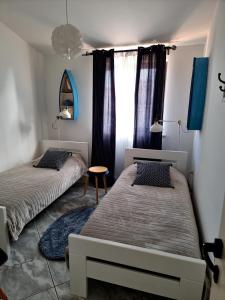 Postel nebo postele na pokoji v ubytování Apartments Noa