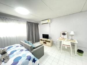 TV a/nebo společenská místnost v ubytování Impact C3 Muathong