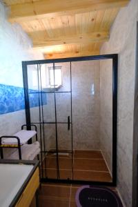 a shower with a glass door in a bathroom at Bungalow green love sapanca in Sapanca