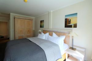 Ένα ή περισσότερα κρεβάτια σε δωμάτιο στο Strandappartement Fischland 123