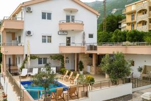 a view of a hotel with a swimming pool at Villa Lux Rajović in Budva