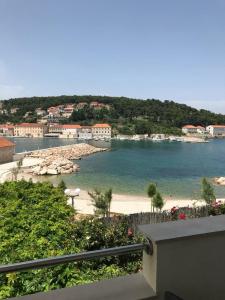 a view of a beach from a balcony at apartmani Isabella - Ilda Radonic in Jelsa