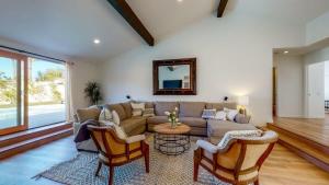 a living room with a couch and two chairs at Mountain View Luxury Nogales Springs Escape in Palm Springs