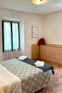 Una cama o camas en una habitación de Albergo Varone