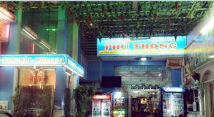 a store with a phued thong sign in a store at Phú Thông in Chau Doc