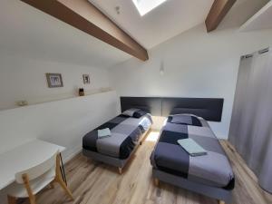 Un pat sau paturi într-o cameră la Villa l'Eden de Camargue- Spa et Nature