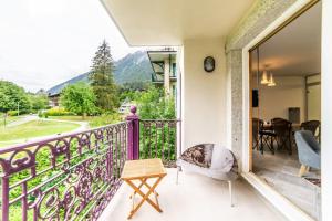 a balcony with a view of the mountains at 3-bedroom flat in the city centre in Chamonix