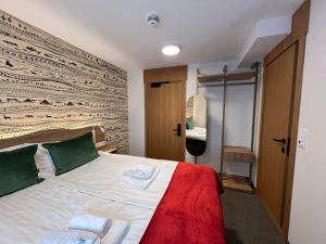 Voodi või voodid majutusasutuse Arctic Hotel Nordkapp toas