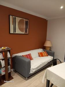 a bedroom with a bed and a picture on the wall at L'auseth in Oloron-Sainte-Marie