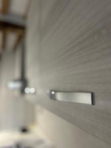 a close up of a metal door in a kitchen at Borgo House in Abbadia San Salvatore +27 photos