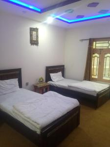 Cama o camas de una habitación en Guest INN Skardu