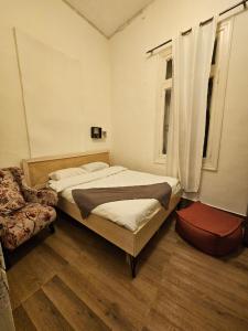 Rúm í herbergi á City Hostel Dormitory