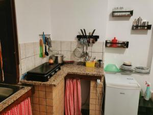 a kitchen with a sink and a counter top at In campagna al Mauto in Modica