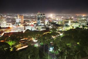 a view of a city at night at Sheraton Kampala Hotel in Kampala