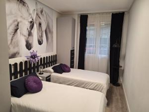 A bed or beds in a room at Intxaurti Etxea Még 37 kép