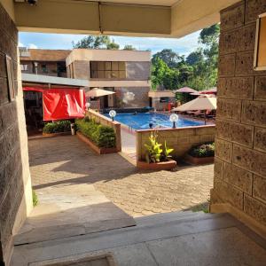 a view of a swimming pool from a building at MOONLIGHT HOMES EAST CHURCH ROAD Westlands in Nairobi