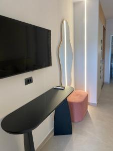 Телевизор и/или развлекательный центр в Villa Diamond