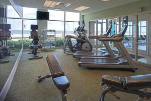 a gym with cardio machines and a view of the ocean at SpringHill Suites by Marriott Virginia Beach Oceanfront in Virginia Beach