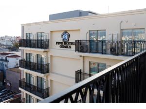 a building with a sign on the side of it at FIVE HOTEL OSAKA - Vacation STAY 47127v in Osaka