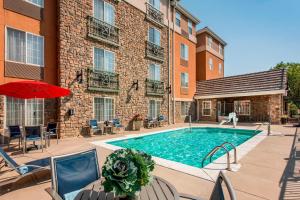 a swimming pool in front of a building at TownePlace Suites by Marriott Boulder Broomfield/Interlocken in Broomfield