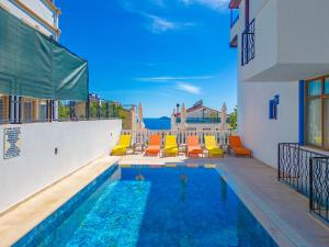 a swimming pool in the middle of a house at Pazar Apartments in Kalkan