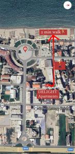 a map of the intersection of a street with a red arrow at Delight Apartments in Golem