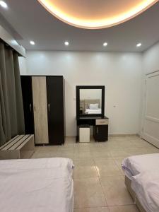 Postel nebo postele na pokoji v ubytování Zain Tabuk Apartment