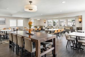 a dining room with tables and chairs at Residence Inn Pasadena Arcadia in Arcadia