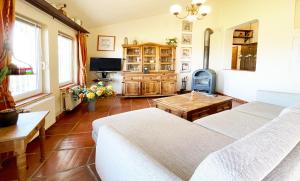 a living room with two white couches and a table at Casa Mora, privater pool, Meerblick, toller Garten in Torrox