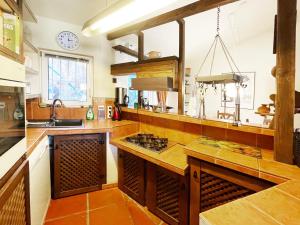 a kitchen with a wooden counter top and a sink at Casa Mora, privater pool, Meerblick, toller Garten in Torrox