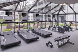 a gym with a bunch of cardio machines at Courtyard Detroit Metro Airport Romulus in Romulus