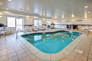 a large swimming pool in a hotel room at Fairfield Inn & Suites by Marriott Saratoga Malta in Malta