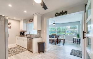 a kitchen and dining room with a table and chairs at Crystal River Getaway with Dock, Kayaks and Bicycles! in Crystal River