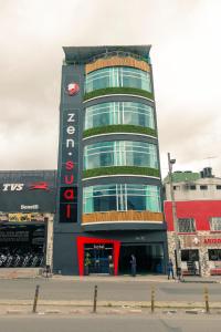 un edificio con un cartel en el costado en Hotel Zensual, en Bogotá