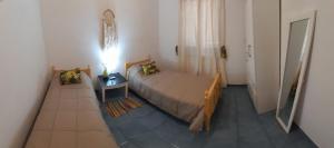 En eller flere senge i et værelse på Home Talampaya