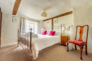 Giường trong phòng chung tại Roger Ground House