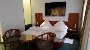 Vuode tai vuoteita majoituspaikassa Hotel Unger