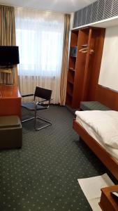 TV tai viihdekeskus majoituspaikassa Hotel Unger