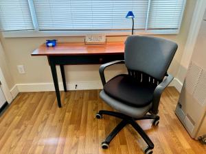 a desk with a chair in front of a window at Great downtown Sandpoint location! in Sandpoint