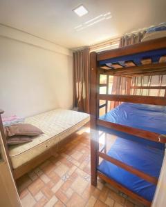 a room with two bunk beds in it at SITIO AMANHECER VERDE in Contagem