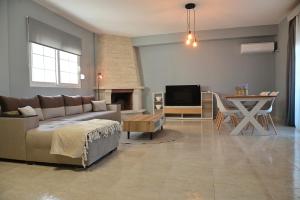 Телевизор и/или развлекательный центр в Marinique Apartment