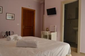Posteľ alebo postele v izbe v ubytovaní B&b Bagheria