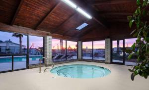 a hot tub in a building with a view of the city at Best Western Plus King's Inn and Suites in Kingman