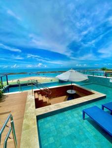 La alberca dentro o cerca de Flat beira-mar em Porto de Galinhas