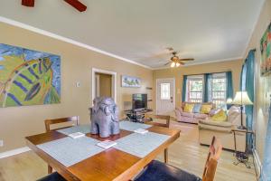 a living room with a table with a statue on it at Biloxi Home Walk to Fishing and 2 Mi to Beach! in Biloxi