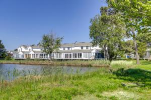 a large white house next to a river at 2 Mi to Beach Gem with Enclosed Patio in Selbyville in Selbyville