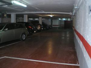 a parking garage with cars parked in it at Apartamentos Zaragoza Centro in Zaragoza