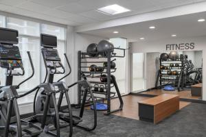 a fitness room with weights and exercise equipment at Fairfield by Marriott Inn & Suites Austin Downtown in Austin