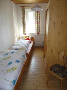 A bed or beds in a room at Hendlmühle